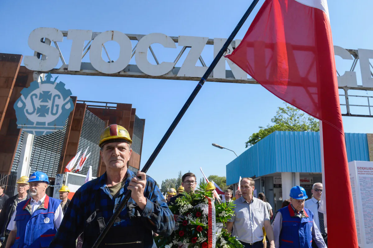 Members of the Solidarity trade union walk by the historical gate of nowadays called Gdansk Shipyard during the 30th Anniversary of partial free elections in Gdansk, Poland, on June 4, 2019. (Omar Marques/Getty Images)
