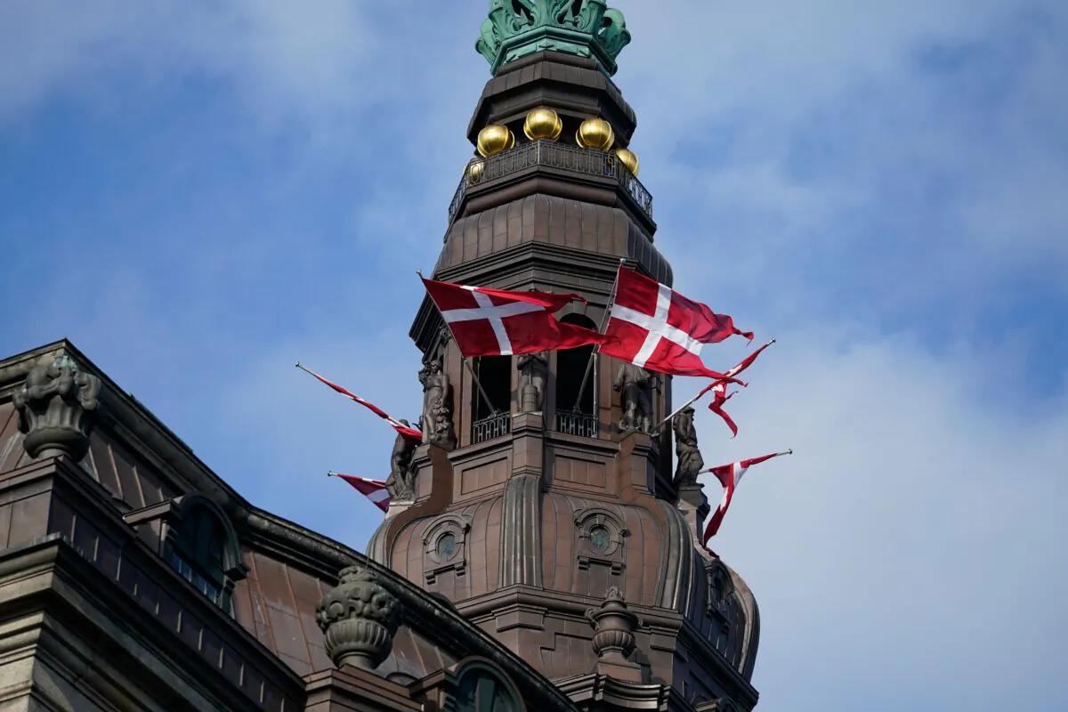 Danish flags (Dannebrog) flutter at Christiansborg Castle in Copenhagen, Denmark, before the official opening of the Danish Parliament, on Oct. 6, 2020. (Mads Claus Rasmussen/Ritzau Scanpix/AFP via Getty Images)