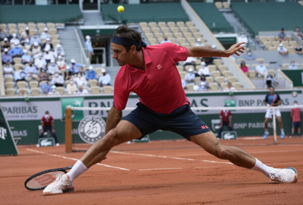 Roger Federer plays a return