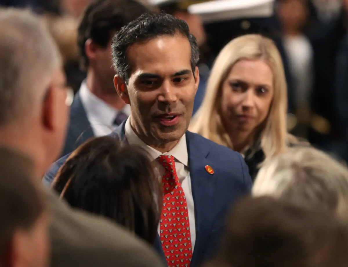 George P. Bush greets mourners in front of the casket of his grandfather the late former President George H.W. Bush as he lies in state in the U.S. Capitol Rotunda, Washington, on Dec. 4, 2018. (Mark Wilson/Getty Images)