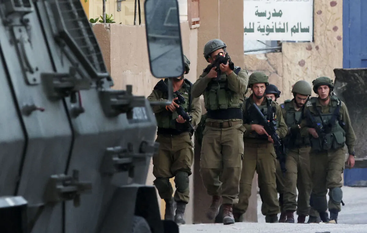 Israeli soldiers walk during a search operation in the village of Salem, east of Nablus in the northern West Bank, on June 3, 2021. (Jaafar Ashtiyeh/AFP via Getty Images)