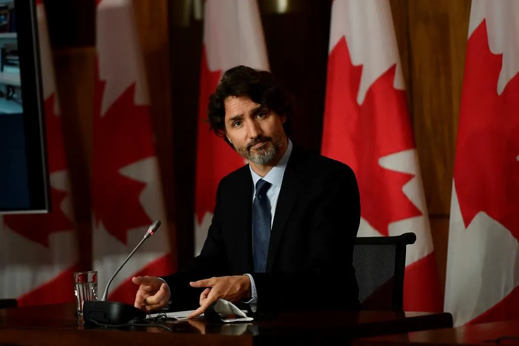 Prime Minister Justin Trudeau arranges his notes as he listens to a question during a news conference in Ottawa on June 4, 2021. (The Canadian Press/Justin Tang)
