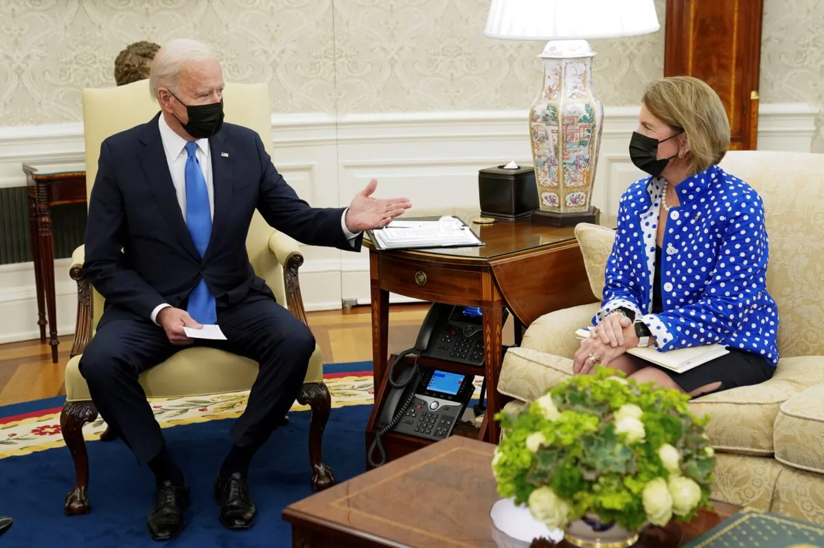 President Joe Biden gestures toward Sen. Shelley Capito (R-W.Va.) during an infrastructure meeting with Republican Senators at the White House in Washington on May 13, 2021. (Kevin Lamarque/Reuters)