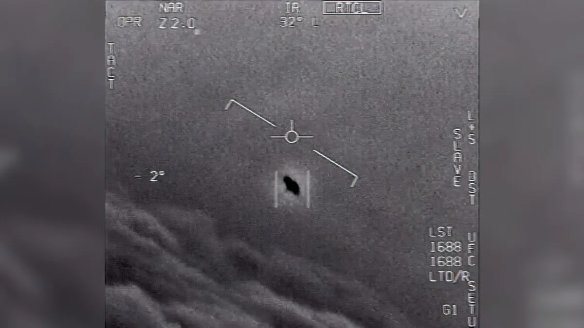 This image from video, labeled GIMBAL and provided in 2015, shows an unexplained object (C) being tracked as it soars high along the clouds, traveling against the wind. (Department of Defense via AP)