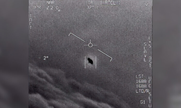 This image from video, labeled GIMBAL and provided by the Department of Defense from 2015, shows an unexplained object (C) being tracked as it soars high along the clouds, traveling against the wind. (Department of Defense via AP)