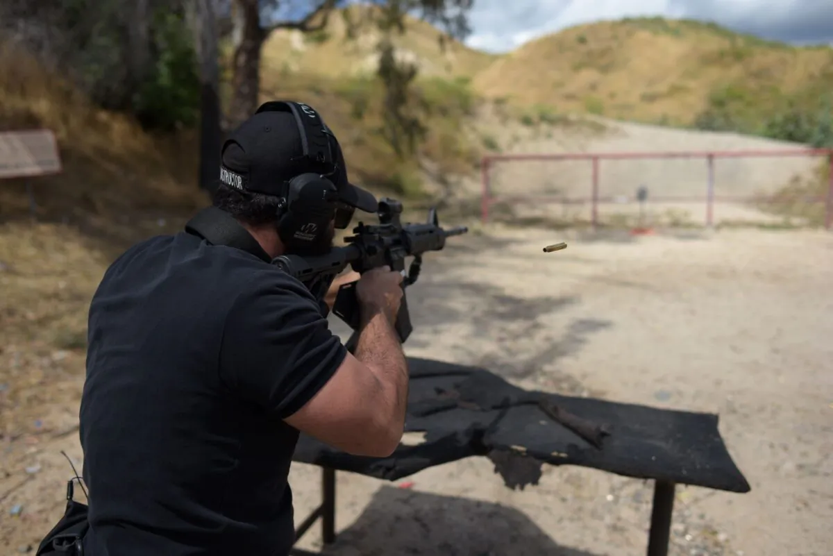 A man shoots an AR-15 style semi-automatic rifle during a demonstration at the Angeles Shooting Ranges in Pacoima, Calif., on May 20, 2019. (Augustin Paullier/AFP via Getty Images)