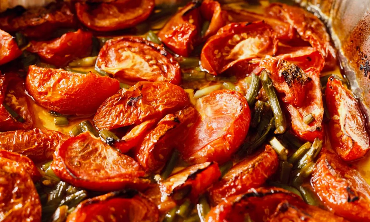 Milder garlic scapes can take the place of garlic in early summer roasted tomatoes. (Dreamstime/TNS)
