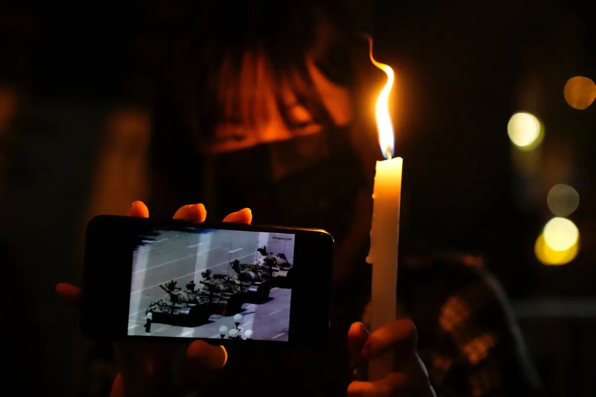 One of the candles lit to mark the anniversary of the massacre of a pro-democracy student movement in Beijing, outside Victoria Park in Hong Kong, on June 4, 2021. (Kin Cheung/AP Photo)