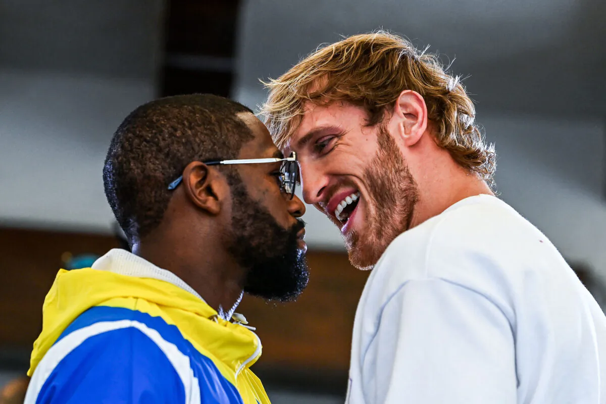 Former world welterweight king Floyd Mayweather (L) and YouTube personality Logan Paul face-off during the media availability ahead of their June 6 exhibition boxing match, at Villa Casa Casuarina at the former Versace Mansion in Miami Beach, Fla., on June 3, 2021. (Chandan Khanna/AFP via Getty Images)