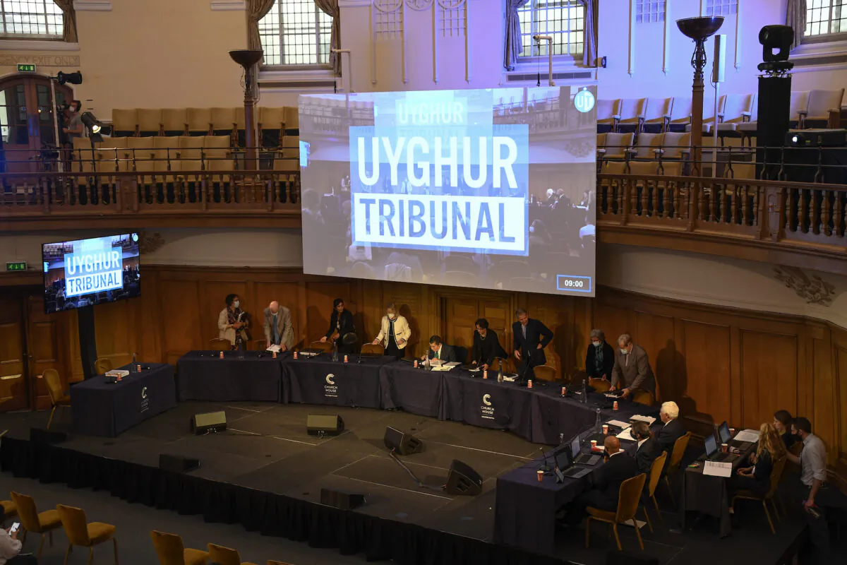Members of the Panel of the independent Uyghur Tribunal take their seats for the first session of the hearings at Church House, in London, UK, on June 4, 2021. (Alberto Pezzali/AP Photo)