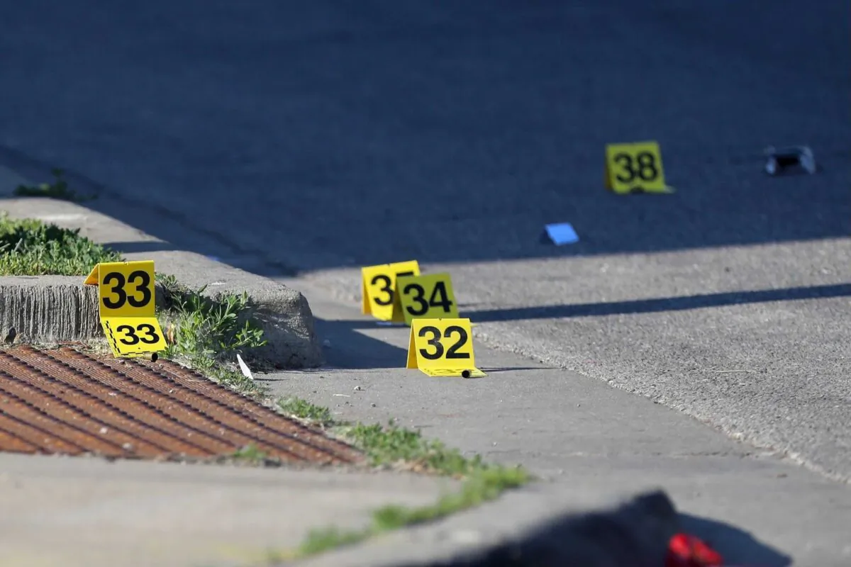 Evidence markers at the crime scene in the 8900 block of South Cottage Grove Avenue on Chicago's South Side in Chicago, Ill., on June 6, 2021. (Vashon Jordan Jr./Chicago Tribune/TNS)