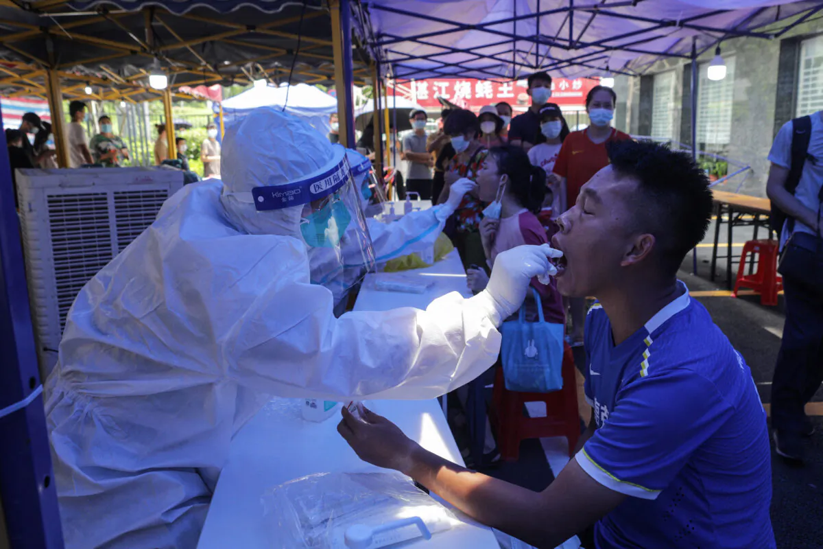 A man receives a nucleic acid test for COVID-19 in Guangzhou, a city in southern China's Guangdong Province, on May 30, 20210. (STR/AFP via Getty Images)
