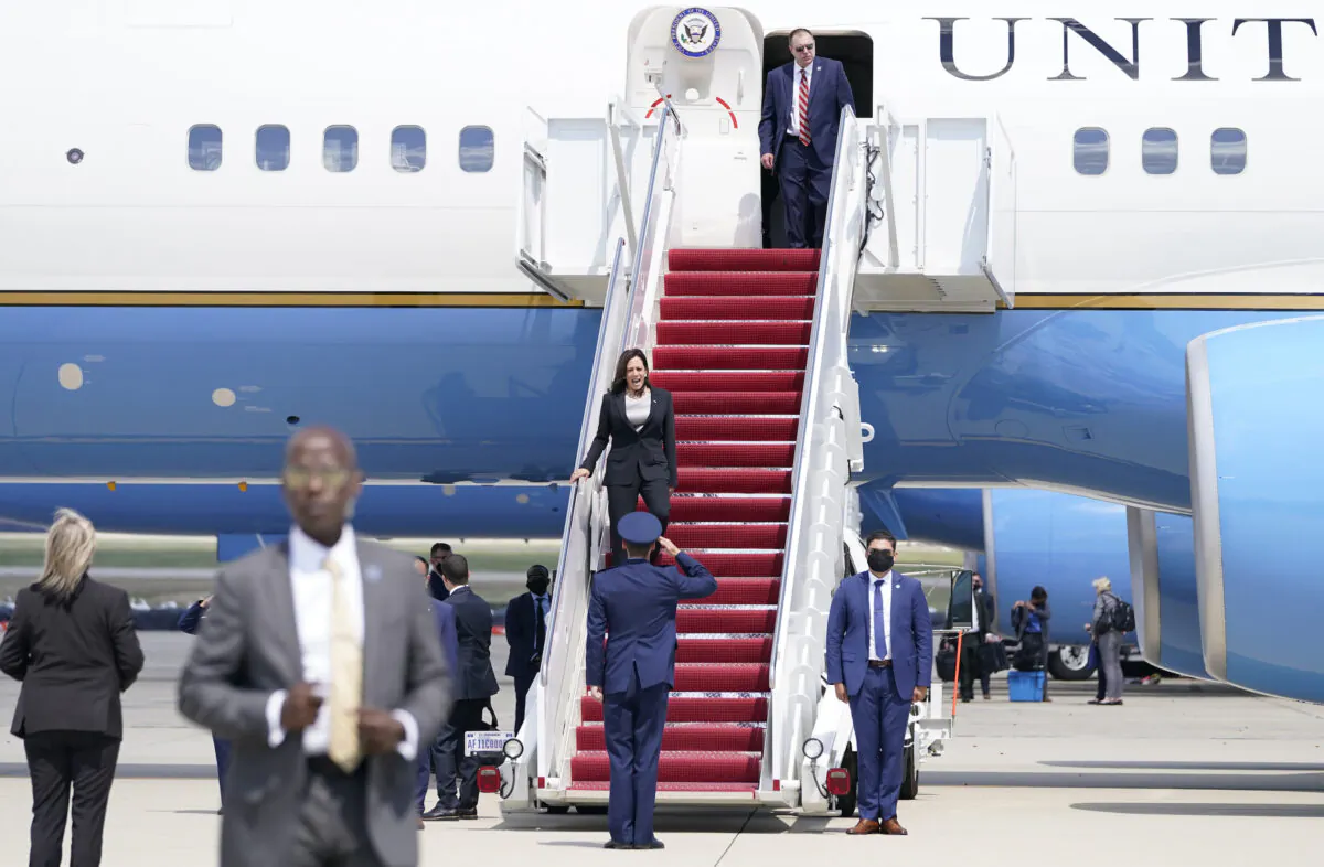 Vice President Kamala Harris is greeted by United States Air Force Lt. Col. Neil Senkowski as she deplanes Air Force Two after a technical issue forced the aircraft to return and land at Andrews Air Force Base, Md., on June 6, 2021. (Jacquelyn Martin/AP Photo)