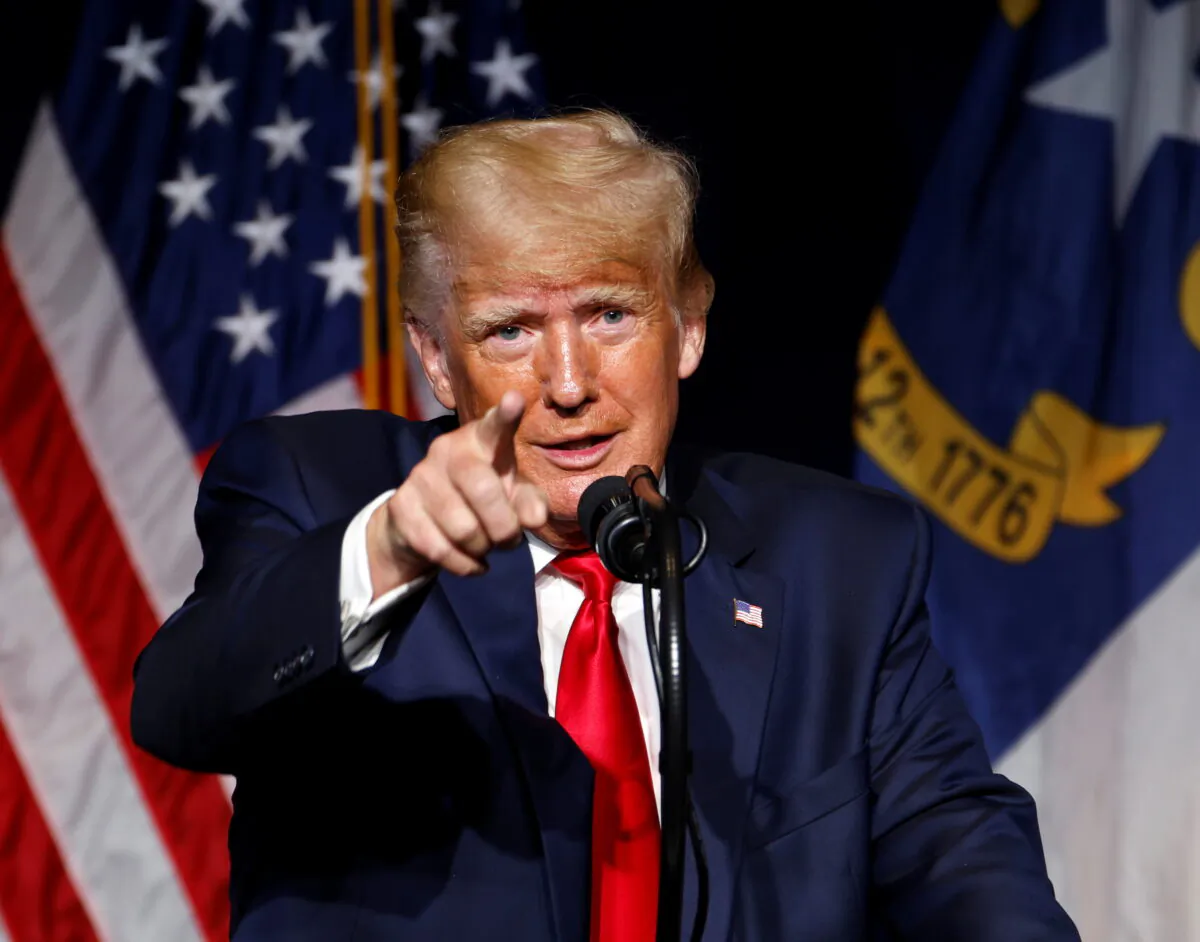 Former U.S. President Donald Trump points to the media while speaking at the North Carolina GOP convention dinner in Greenville, N.C., on June 5, 2021. (Jonathan Drake/Reuters)