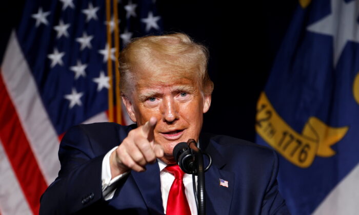 Former U.S. President Donald Trump points to the media while speaking at the North Carolina GOP convention dinner in Greenville, N.C., on June 5, 2021. (Jonathan Drake/Reuters)