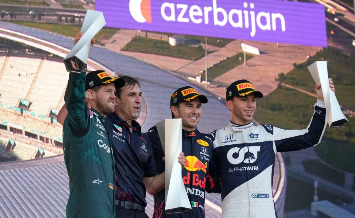 First place, Red Bull driver Sergio Perez of Mexico (2nd-R) stands on the podium with second place, Aston Martin driver Sebastian Vettel of Germany (L) and third place, AlphaTauri driver Pierre Gasly of France (R) during the Formula One Grand Prix at the Baku Formula One city circuit in Baku, Azerbaijan, on June 6, 2021. (Darko Vojinovic/AP Photo)