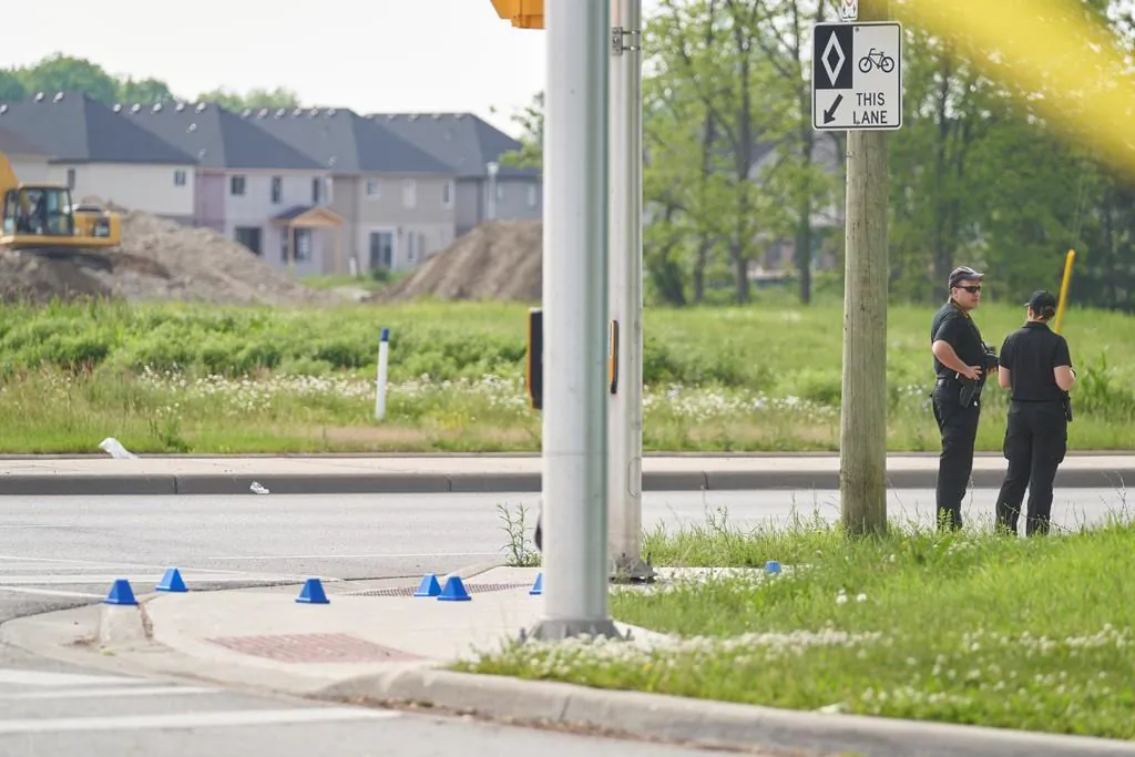 London Police investigate the scene of a car crash in London, Ontario on June 7, 2021. Police in London, Ont., say four people have died after several pedestrians were struck by a car Sunday night.
(The Canadian Press/Geoff Robins)