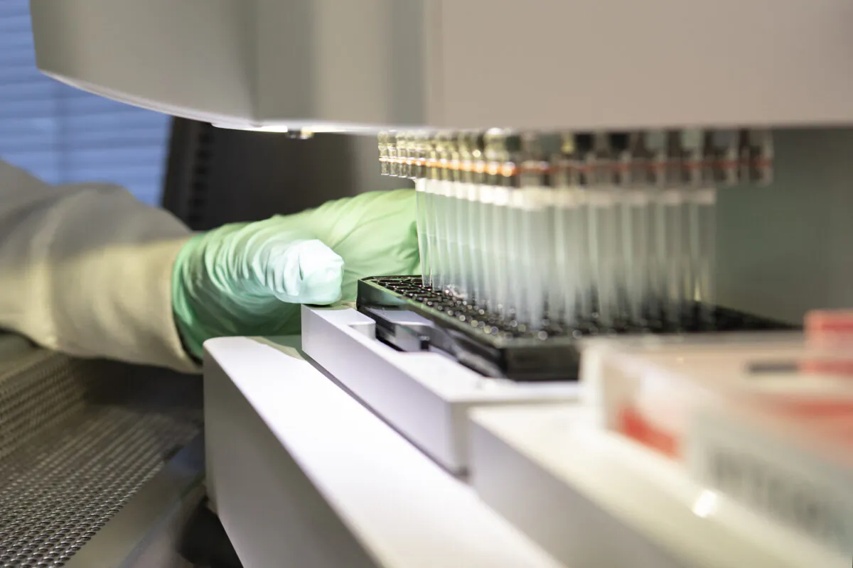 A researcher works on the development of the medication aducanumab in Cambridge, Mass., in 2019. (Biogen via AP)