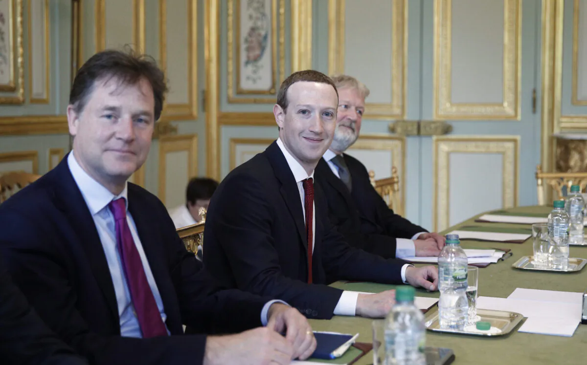 CEO and co-founder of Facebook Mark Zuckerberg poses next to Facebook head of global policy communications and former UK deputy prime minister Nick Clegg (L) prior to a meeting with French President at the Elysee Palace in Paris on May 10, 2019. (YOAN VALAT/AFP via Getty Images)