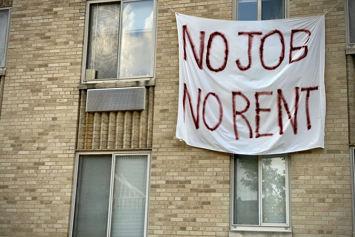 A banner against renters eviction reading "no job, no rent" is displayed on a controlled rent building in Washington, D.C., on Aug. 9, 2020. (Eric Baradat/AFP via Getty Images)