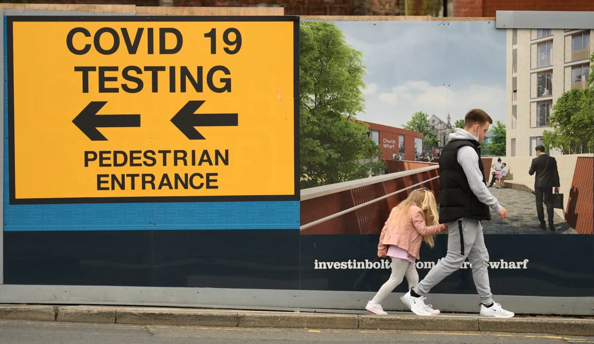 A sign directing members of the public to a COVID-19 testing centre in Bolton, northwest England, on May 28, 2021. (Oli Scarff/AFP via Getty Images)