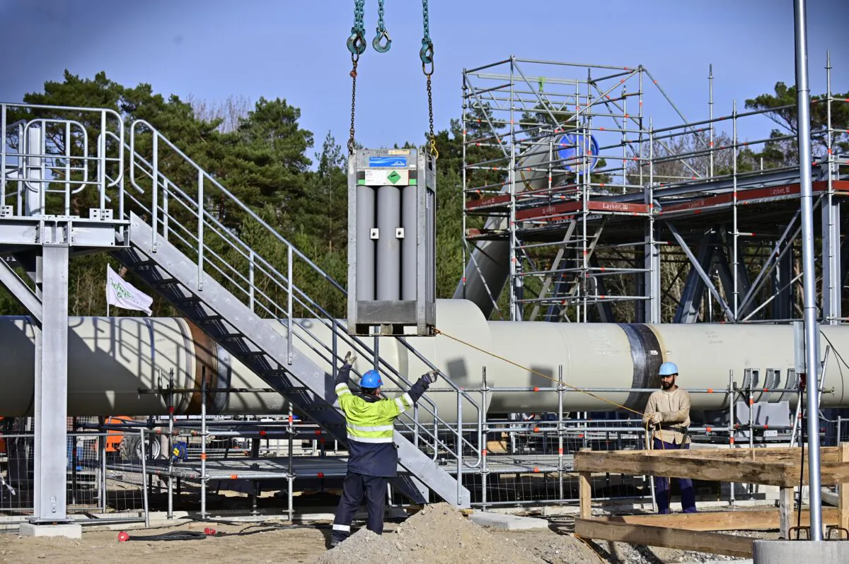 Men work at the construction site of the Nord Stream 2 gas pipeline in Lubmin, northeastern Germany, on March 26, 2019. (Tobias Schwarz/AFP via Getty Images)
