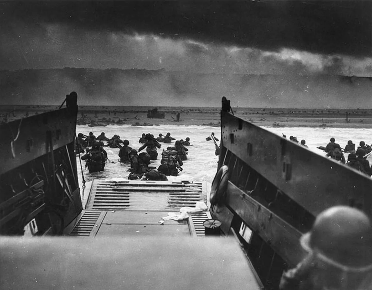 This photo shows the U.S. Army troops wading ashore at Omaha Beach in north-western France, during the D-Day invasion, on June 6, 1944. (Robert F. Sargent/STF/National Archives/AFP/Getty Images)