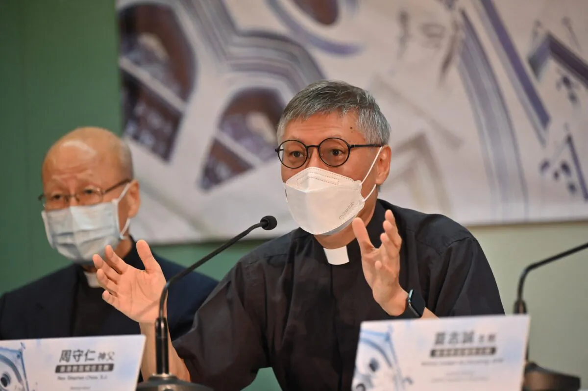 Newly appointed Bishop of Hong Kong Rev. Stephen Chow (R) speaks at a press conference with Cardinal John Tong (L) in Hong Kong on May 18, 2021. (Peter Parks/AFP via Getty Images)
