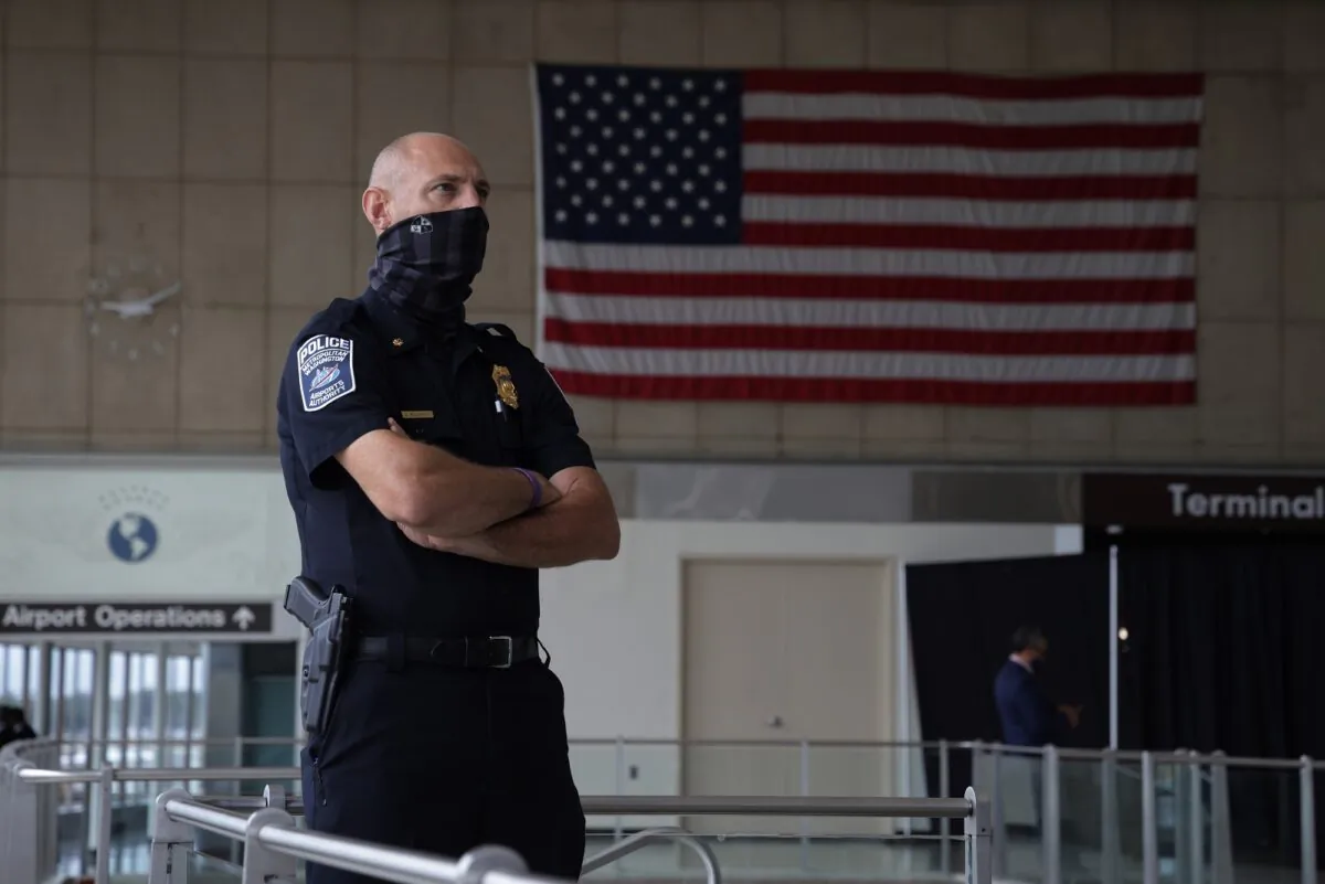A Metropolitan Washington Airports Authority Police officer looks on during a news conference at Ronald Reagan Washington National Airport in Arlington, Va., on May 25, 2021. (Alex Wong/Getty Images)
