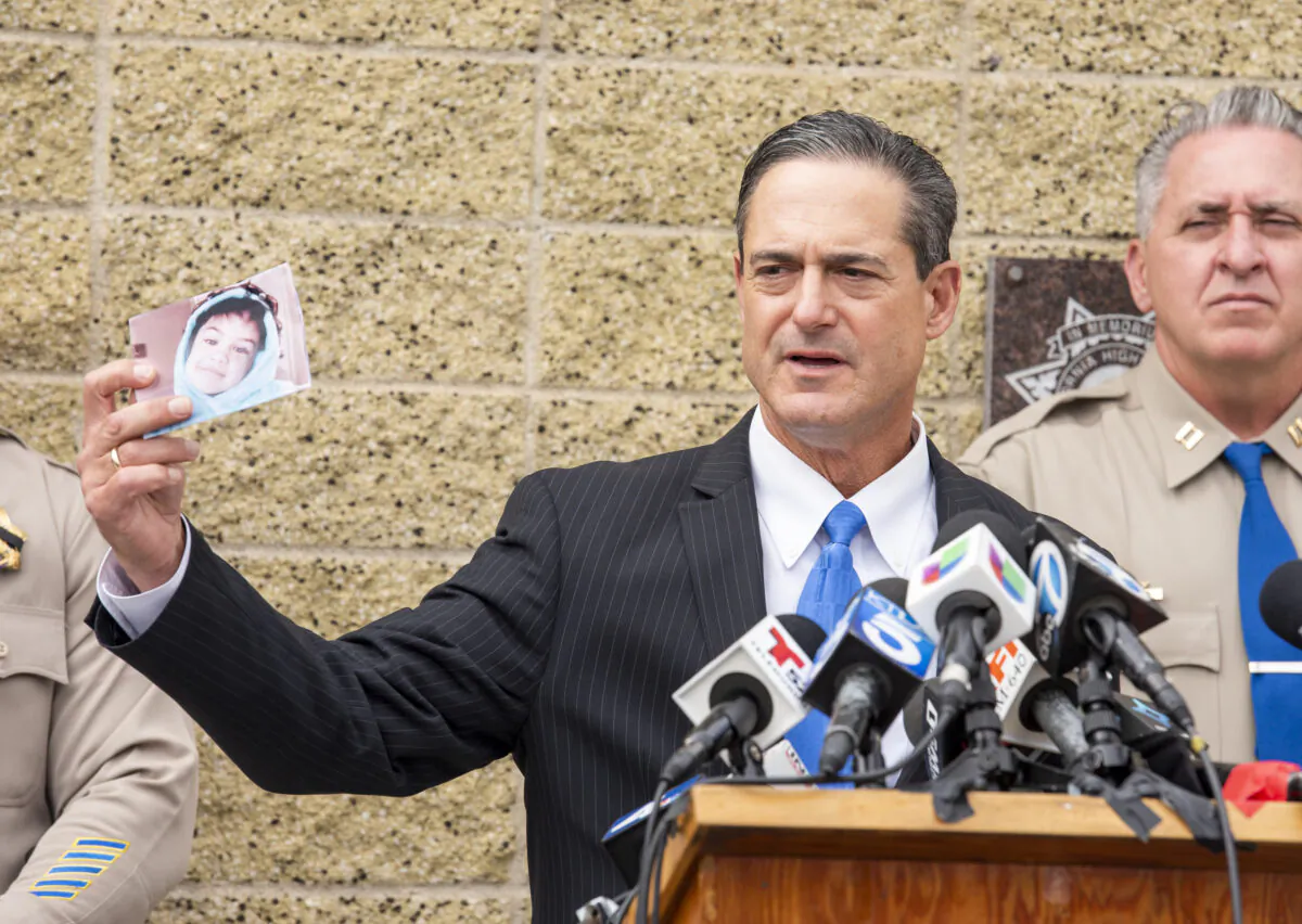 Orange County District Attorney Todd Spitzer holds up a photo of Aiden Leos during a news conference outside the CHP office in Santa Ana, Calif. on June 7, 2021. (Leonard Ortiz/The Orange County Register via AP)