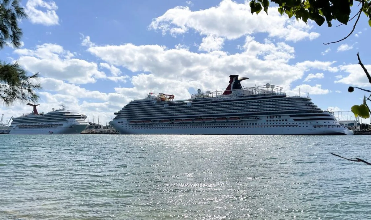 The cruise ships "Carnival Sunrise" (L) and "Carnival Vista" (R) part of the Carnival Cruise Line, are seen moored at a quay in the port of Miami, on Dec. 23, 2020. (Daniel Slim/AFP via Getty Images)