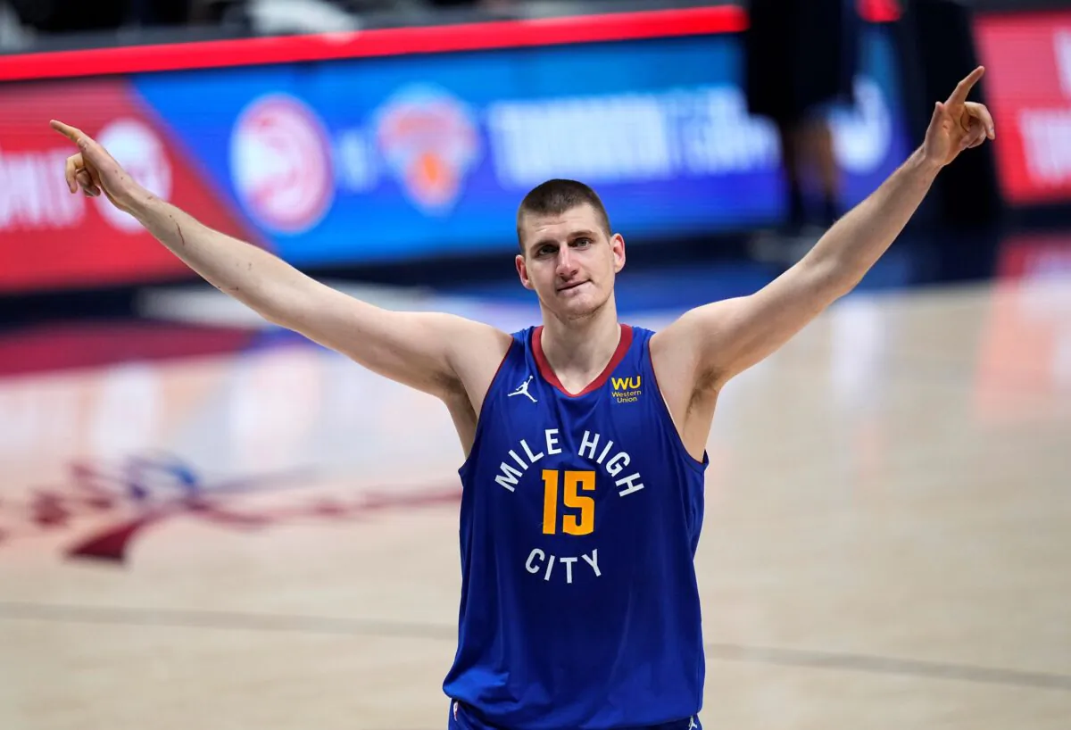 Denver Nuggets center Nikola Jokic (15) celebrate the team's double-overtime win against the Portland Trail Blazers in Game 5 of a first-round NBA basketball playoff series in Denver, Colo., on June 1, 2021. (Jack Dempsey/AP Photo)