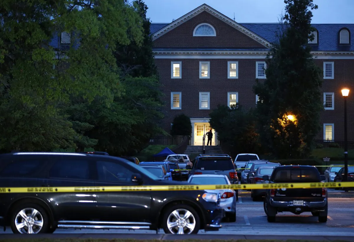 A law enforcement official stands at an entrance to a municipal building that was the scene of a shooting in Virginia Beach, Va., on June 1, 2019. (Patrick Semansky/AP Photo)