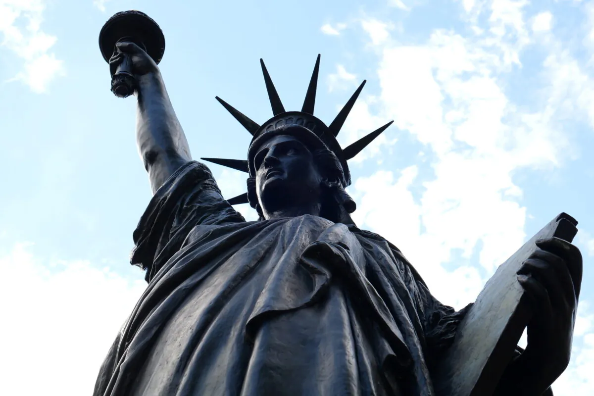 A 2.83-meter (9.3-foot) original replica of the Statue of Liberty is seen in front of the Musee des Arts et Metiers in Paris, France, on June 2, 2021. (Noemie Olive/Reuters)