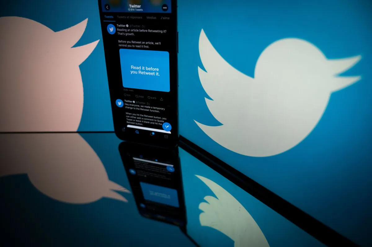 The logo of Twitter is displayed on the screen of a smartphone and a tablet in Toulouse, France, on Oct. 26, 2020. (Lionel Bonaventure/AFP via Getty Images)