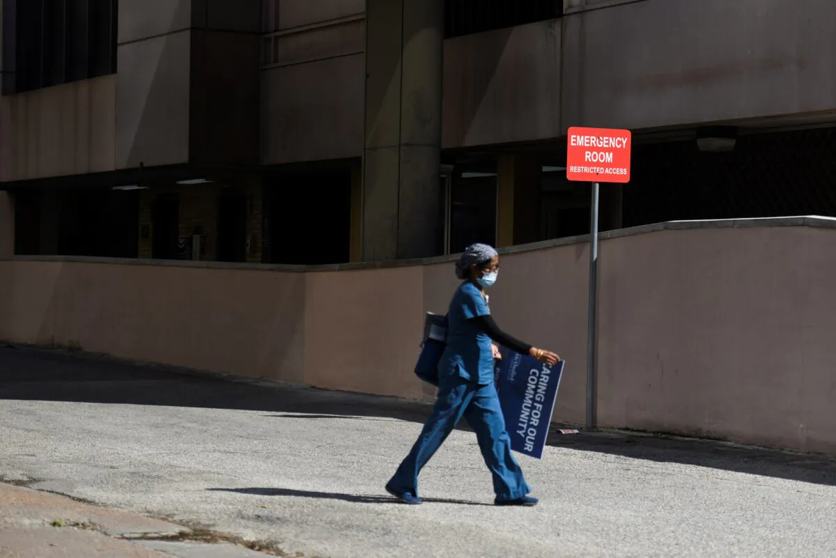 A health care worker leaves Houston Methodist Hospital in Houston, Texas, on May 4, 2020. (Callaghan O'Hare/Reuters)