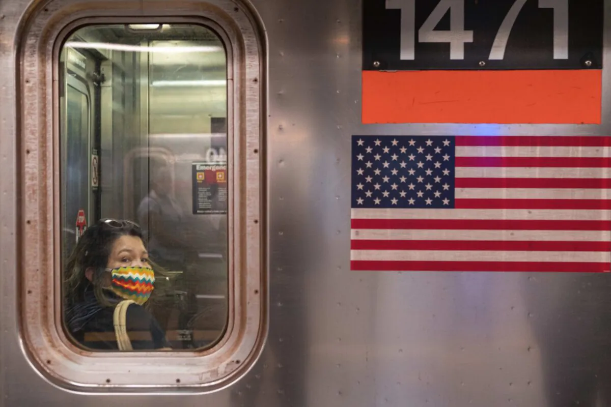 A person wearing a mask rides the subway during rush hour on the first day of phase one of the reopening after the coronavirus lockdown in New York City on June 8, 2020. (David Dee Delgado/Getty Images)