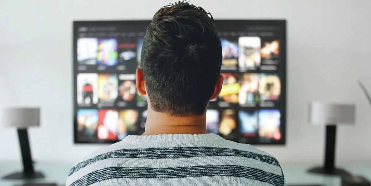 Undated photo showing a man watching advertising on a screen. (mohamed_hassan/Pixabay)