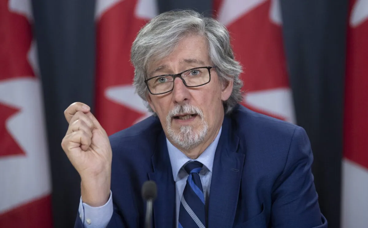 Privacy Commissioner Daniel Therrien speaks during a news conference in Ottawa, Dec. 10, 2019. The federal privacy czar says Canada's border agency violated the law by carrying out overly invasive searches of personal digital devices, in one case viewing a traveller's social media and online banking information. (The Canadian Press/Adrian Wyld)