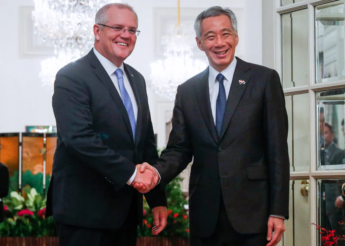 Australia's Prime Minister Scott Morrison (L) and Singapore's Prime Minister Lee Hsien Loong shake hands at the Istana Presidential Palace in Singapore on June 7, 2019. (Wallace Woon / Pool / AFP via Getty Images)