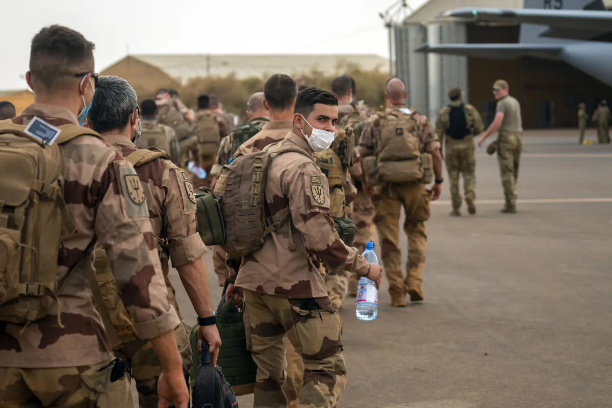 French Barkhane force soldiers who wrapped up a four-month tour of duty in the Sahel board a U.S. Air Force C130 transport plane to leave their base in Gao, Mali, on June 9, 2021. (Jerome Delay/AP Photo)
