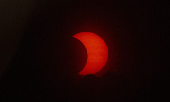 See the Spectacular Solar Eclipse Painting the Sky Red in New Jersey