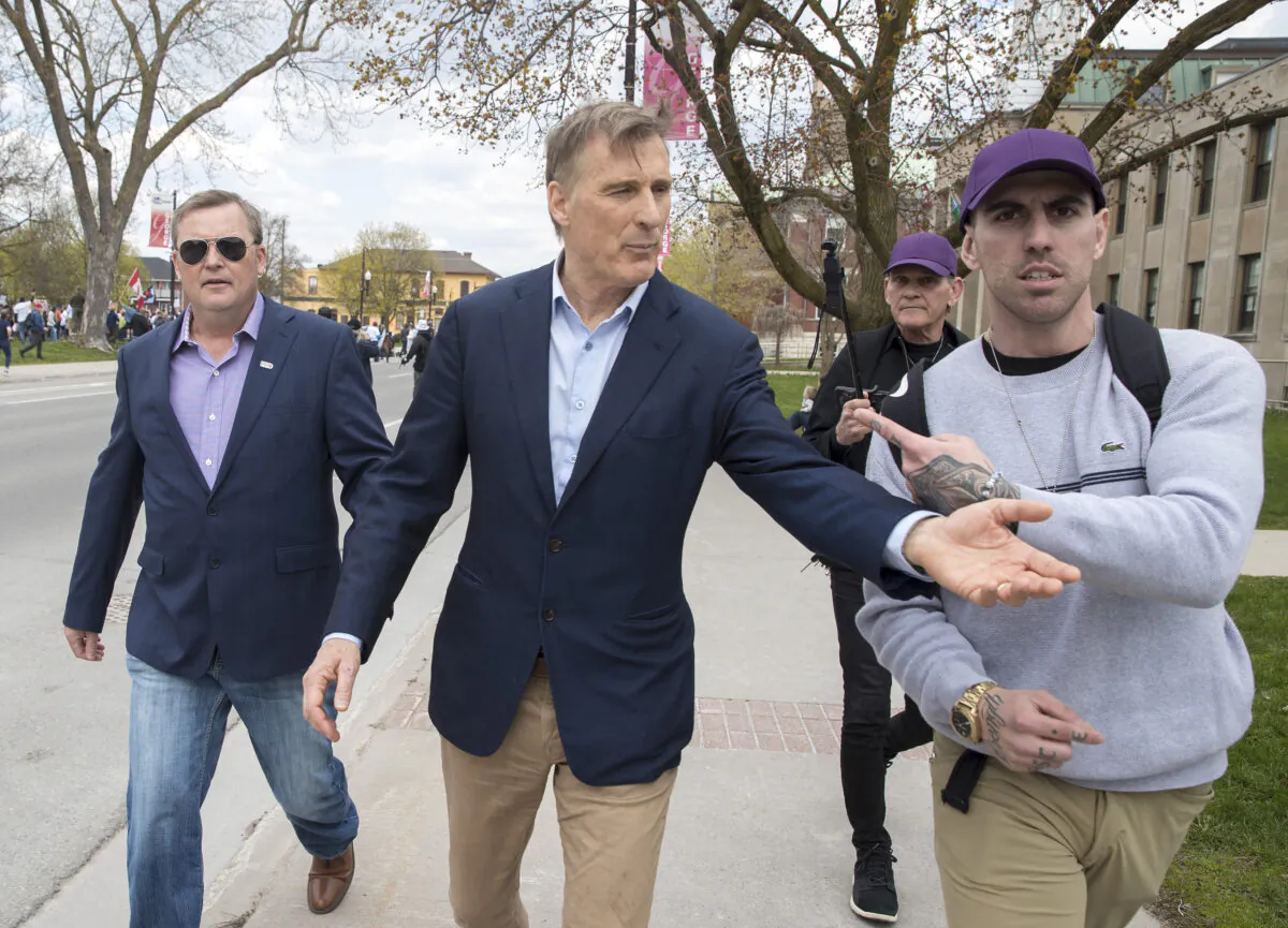 People's Party of Canada Leader Maxime Bernier leaves a protest against COVID-19 restrictions, in Peterborough, Ont., on April 24, 2021. (The Canadian Press/Fred Thornhill)