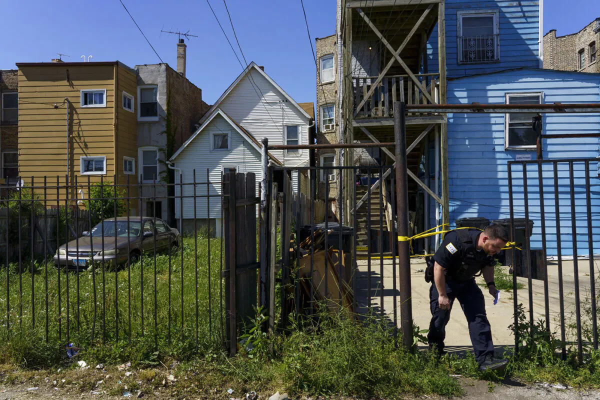 An evidence technician works the scene where a teenage boy was fatally shot in the 1100 block of South Karlov Avenue in Chicago's Lawndale neighborhood, on June 10, 2021. (Armando L. Sanchez/Chicago Tribune/TNS)