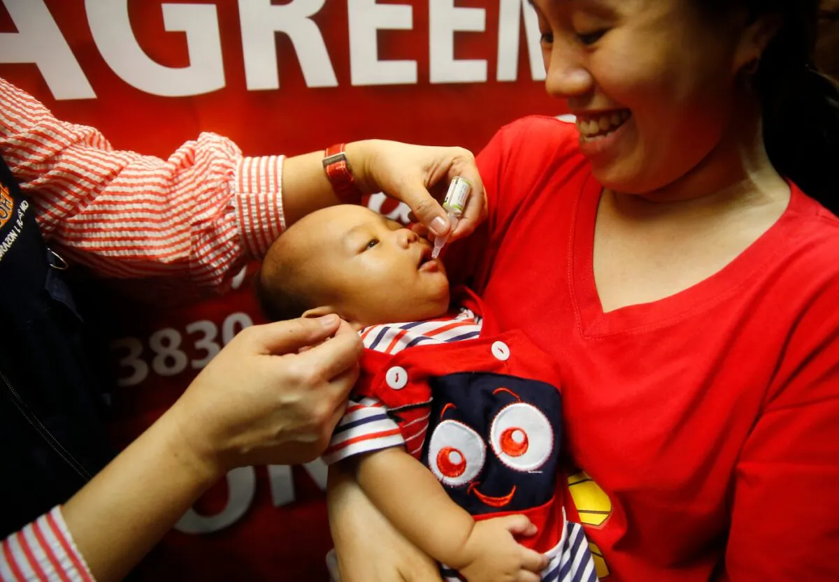 A baby gets an oral anti-polio vaccine during the launch of a campaign to end the resurgence of polio after health authorities confirmed a polio case in the country in Quezon city, the Philippines, on Sept. 20, 2019. (Bullit Marquez/File/AP Photo)