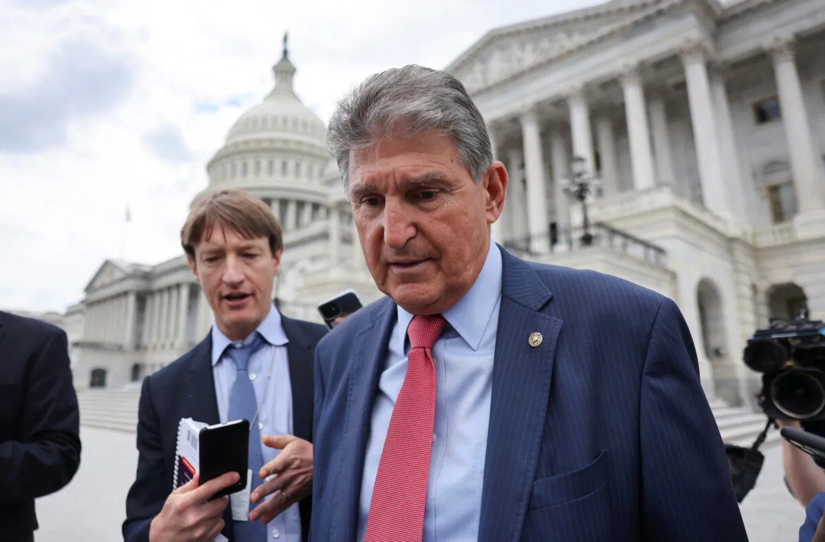 Sen. Joe Manchin (D-W.Va.) talks to reporters as he departs the U.S. Capitol after a vote in the Senate on Capitol Hill on June 10, 2021. (Evelyn Hockstein/Reuters)