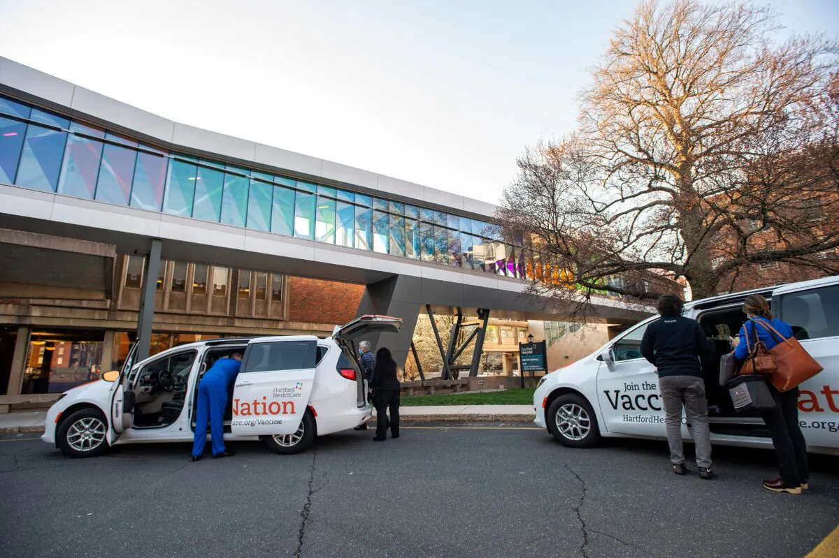 Hospital staffers are seen outside Hartford Hospital in Hartford, Conn., on April 20, 2021. (Joseph Prezioso/AFP via Getty Images)