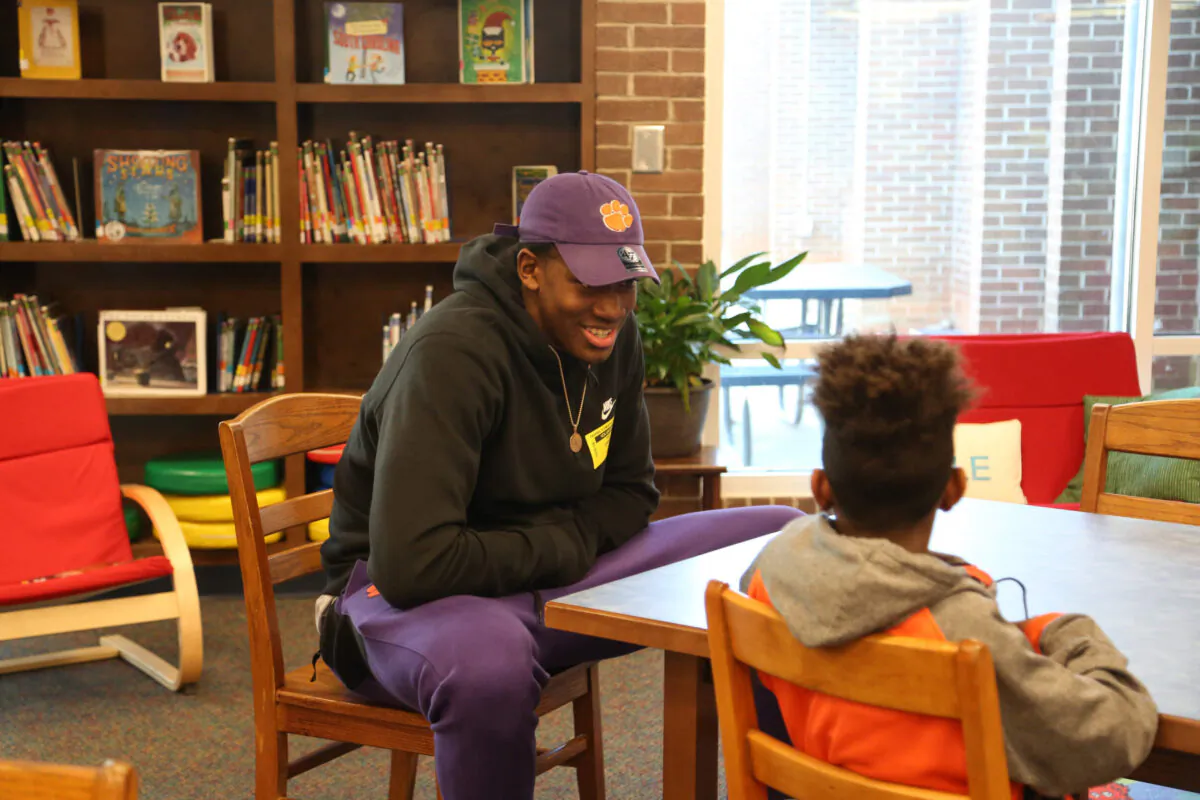 Clemson University student athlete Trey Jemison mentoring young students. (Clemson University)