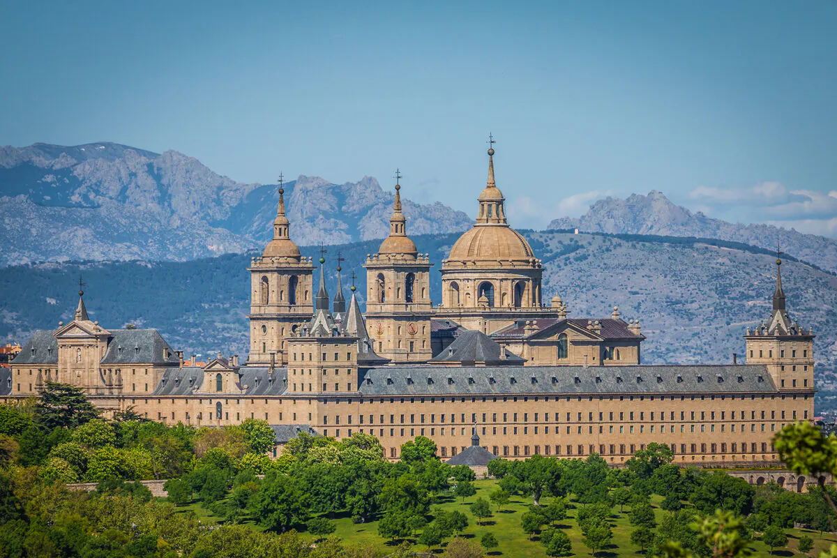 To secure and ensure the longevity of El Escorial, it was built like a fortress from gray granite quarried from the surrounding mountains. It is located 55 miles west of Madrid, in the heart of Spain. (Lukasz Janyst/Shutterstock)