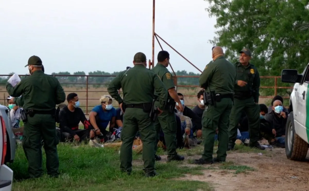 In a still image from a video released by NTD, Border Patrol agents detain illegal immigrants in McAllen, Texas. (Sunny Yang/NTD)